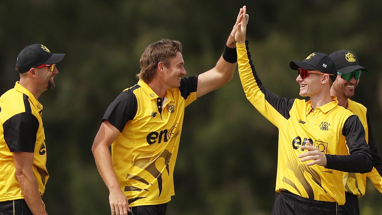 Bryce Jackson celebrates his fifth wicket with WA teammate Cameron Bancroft after a sharp catch at mid-wicket removed Daniel Drew for 49. Picture: Mark Metcalfe / Getty Images