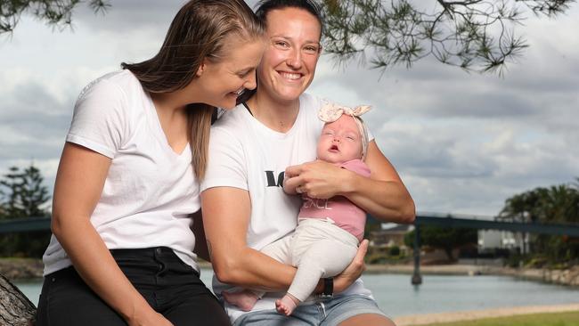 Australian international cricketer Megan Schutt poses with her wife Jess and their daughter Rylee during a portrait session in Adelaide on January 17, 2022 in Adelaide, Australia. Picture: Sarah Reed/Getty Images