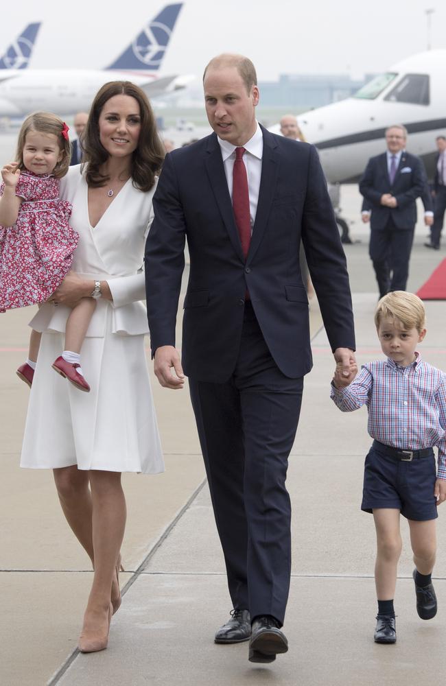 Princess Charlotte (left) already looks like she’s having a lot more fun than her big brother, Prince George (far right).