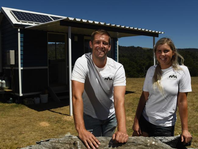 Siblings Ben and Aimee Stanton outside the tiny house. Picture: James Ross