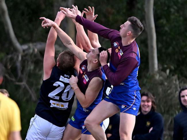 NFL: Banyule and Epping players fly for the mark. Picture: Andy Brownbill