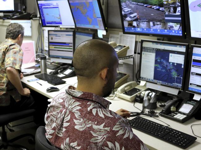 Hawaii Emergency Management Agency officials work at the department’s command centre in Honolulu. Picture: Caleb Jones/AP