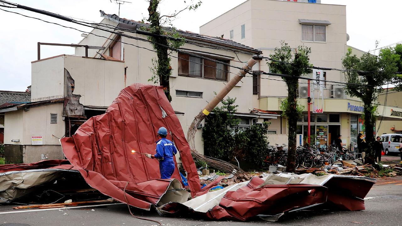 A worker removes debris in Miyazaki after Typhoon Shanshan hit on August 29, 2024. Picture: JIJI Press / AFP