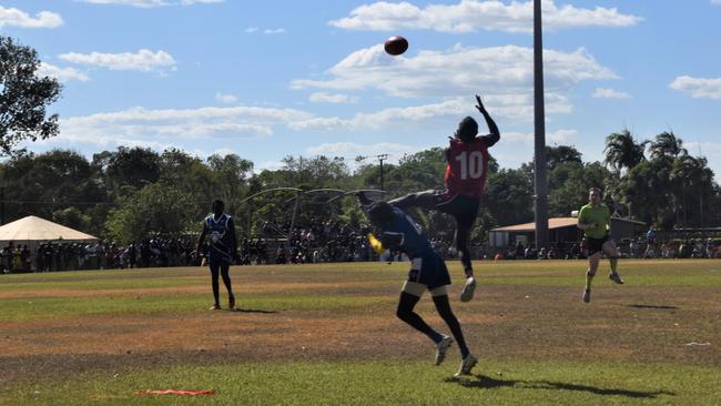 Thunder’s Adam Tipungwuti takes the mark of the day in the Tiwi Island Football League grand final between Tuyu Buffaloes and Pumarali Thunder. Picture: Max Hatzoglou