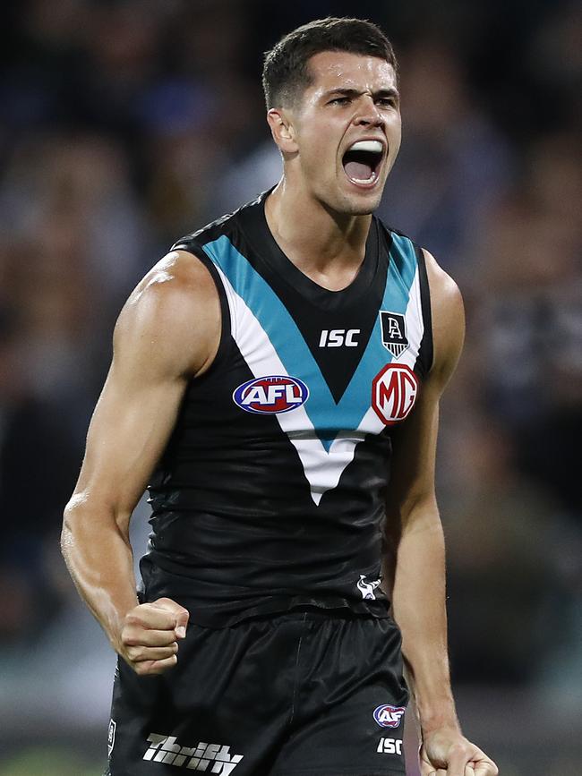 Ryan Burton celebrates after beating the Cats. Picture: Getty Images