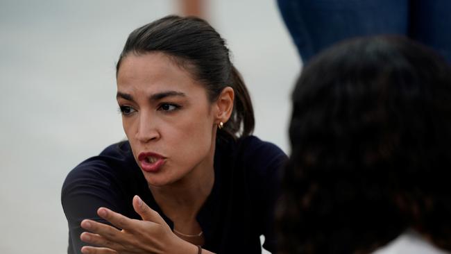 Democrat reps Alexandria Ocasio-Cortez (D-NY) speaks with Representative Cori Bush (D-MO) in Washington DC.