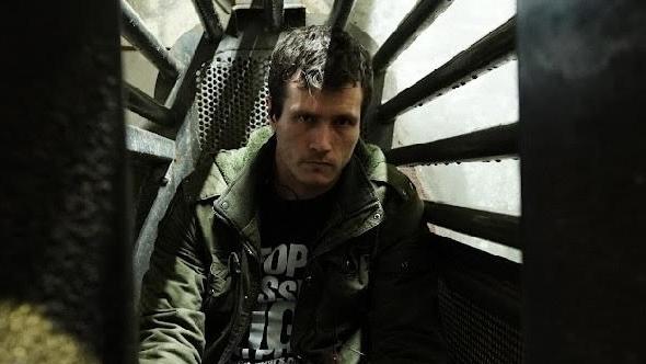 Activist Chris Delforce sits inside a gondola used to lower pigs into gas. Picture: Supplied