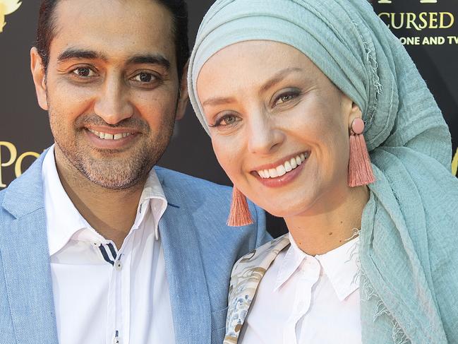 Waleed Aly and wife Susan Carland pose on the red carpet at the Melbourne premier of Harry Potter and the Cursed Child in Melbourne, Saturday, February 23, 2019. (AAP Image/Ellen Smith) NO ARCHIVING