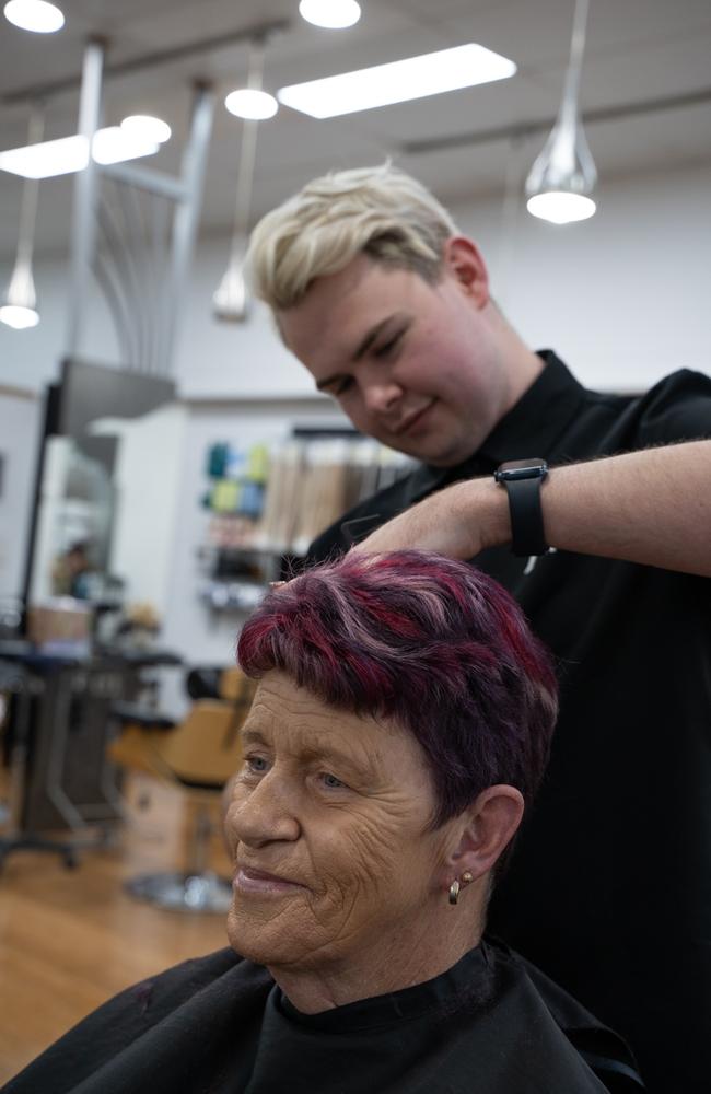 Rance Boreham works on Jenny Ross' hair. Ms Ross said she constantly gets compliments. She was not surprised when Hair Review won best hairdresser of 2023 as she voted for them. Picture: Christine Schindler