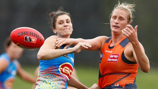 Gold Coast’s Jasmyn Hewett and GWS’ Ingrid Nielsen compete for the ball. Picture: AAP