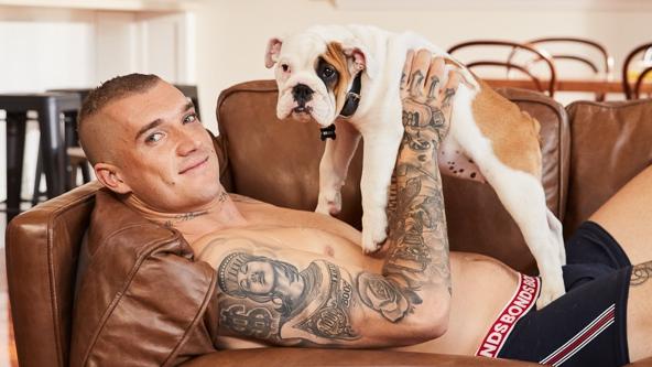 Dustin Martin behind the scenes on his first TV commercial for Bonds with dog Killer. Picture: Bonds