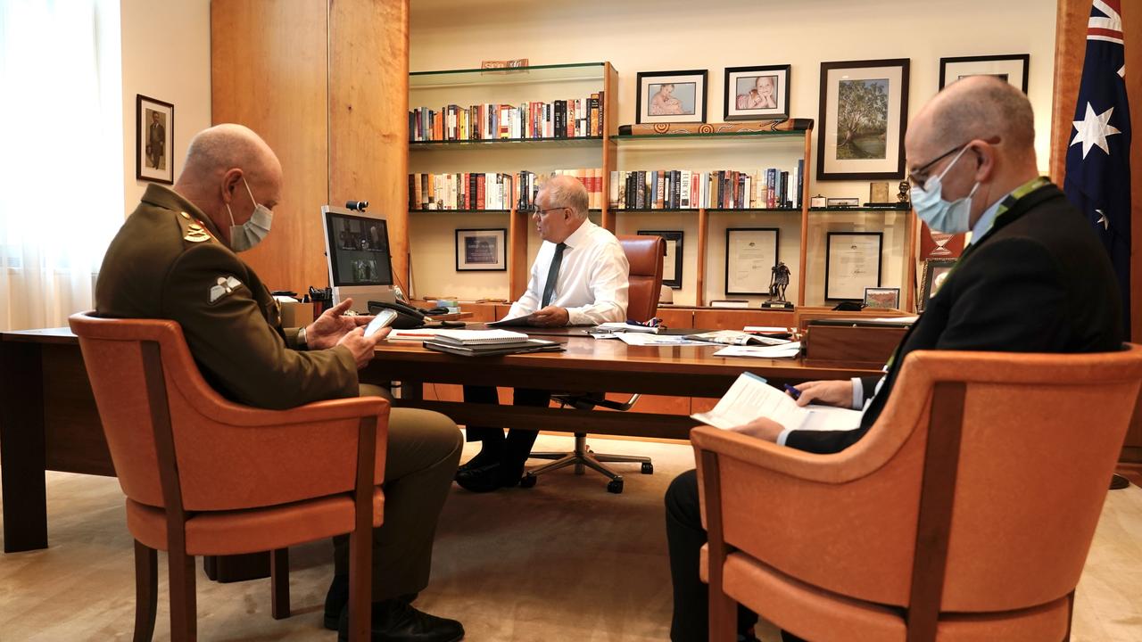 Prime Minister Scott Morrison holds a Omicron briefing to deal with health and supply issues with Lieutenant General Frewen and CHO Professor Paul Kelly at Parliament House. Picture: Adam Taylor