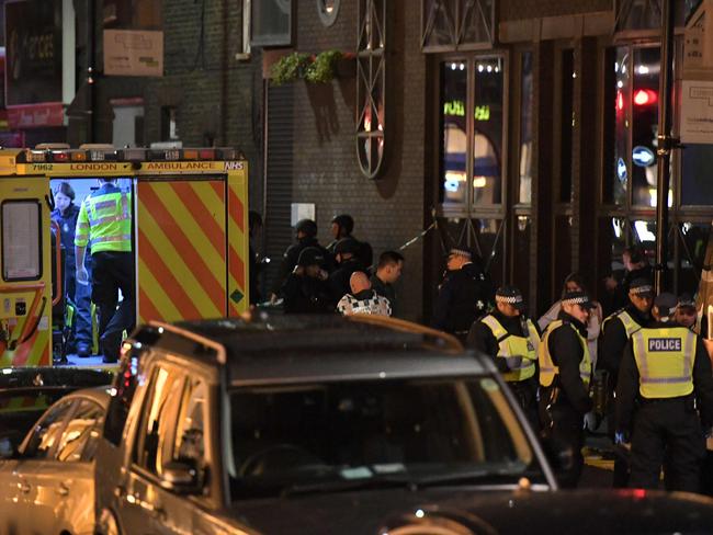 Police and members of the emergency services work at the scene of a terror attack near London Bridge. Picture: AFP