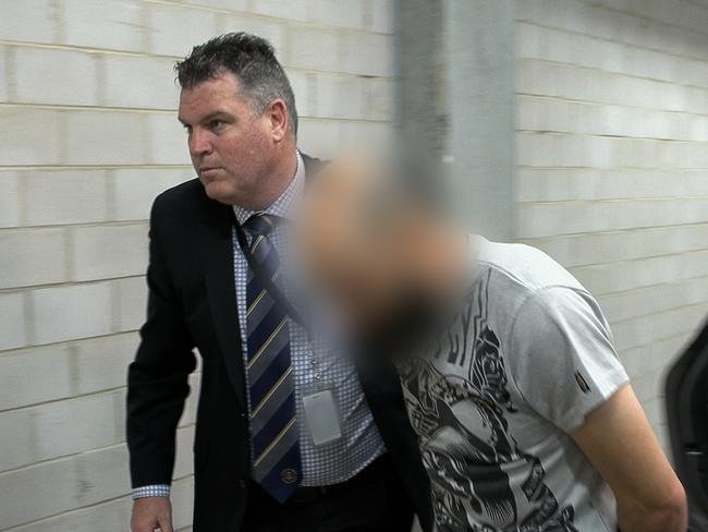 Police arrest Vincent Lambroglou in october last year. His charges remain before the court and he is yet to enter a plea, but his wife Maria has confessed to her crimes in court. Picture: NSW Police