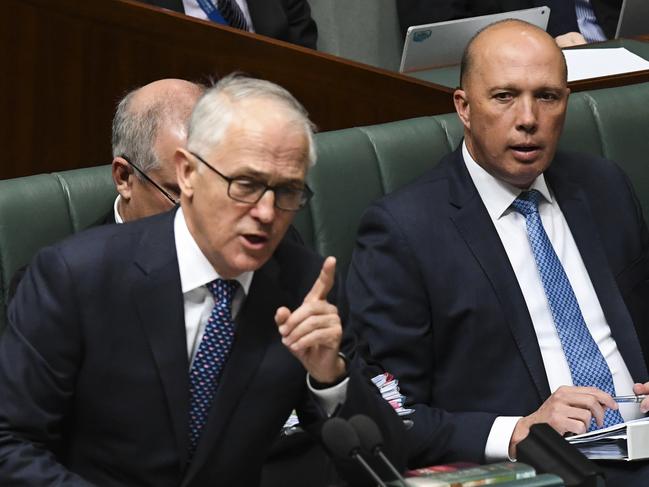 Australian Home Affairs Minister Peter Dutton is seen behind Australian Prime Minister Malcolm Turnbull during House of Representatives Question Time at Parliament House in Canberra, Monday, August 20, 2018.  (AAP Image/Lukas Coch) NO ARCHIVING