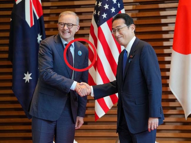 Anthony Albanese was seen wearing a blue badge while meeting Japanese Prime Minister Fumio Kishida. (Photo by ZHANG Xiaoyu / various sources / AFP)