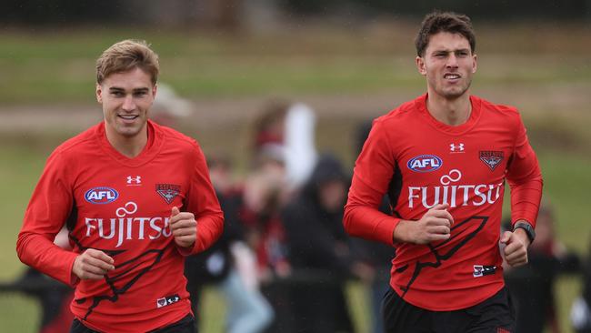 Matt Guelfi (left) and Archie Perkins (right) could both return against West Coast in Perth on Saturday night. Picture: Daniel Pockett / Getty Images