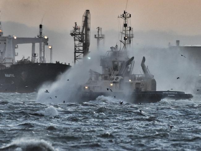 A tugboat cops a spray during some high winds. Picture: Tony Gough