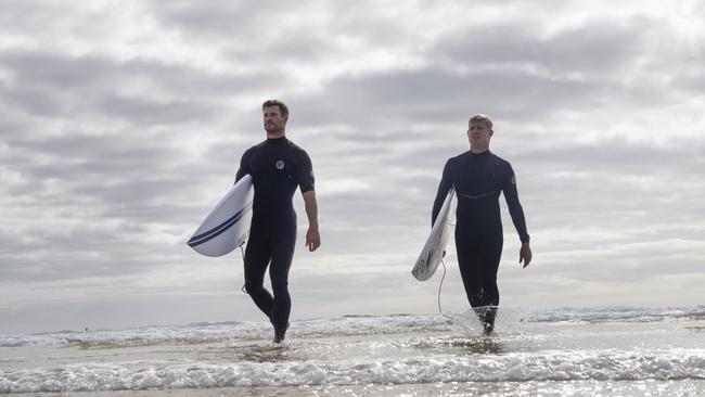 Sharks ain’t gonna stop Hemsworth or Mick Fanning from surfing. Picture: National Geographic/Craig Parry