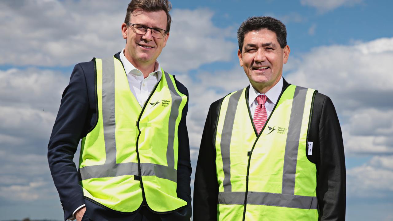 Federal MP Alan Tudge (left) and NSW MP Geoff Lee at Badgerys Creek airport in Sydney. Mr Tudge has said Sydney is well ahead of Melbourne on new road and rail projects. Picture: Adam Yip