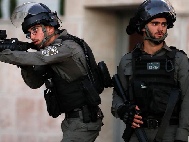 Israeli border guards stand at attention in the east Jerusalem neighbourhood of Sheikh Jarrah. Picture: AFP