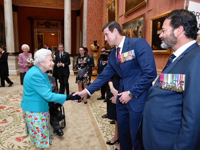 The late Queen Elizabeth II shakes hands with Ben Roberts-Smith VC during a reception for the Victoria Cross and George Cross Association at in the Picture Gallery at Buckingham Palace. Picture: Getty Images