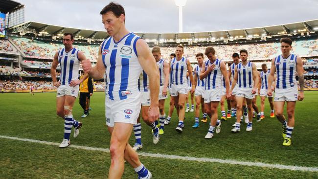 MELBOURNE, AUSTRALIA — AUGUST 13: Brent Harvey of the Kangaroos leads the team off after defeat during the round 21 AFL match between the Hawthorn Hawks and the North Melbourne Kangaroos at Melbourne Cricket Ground on August 13, 2016 in Melbourne, Australia. (Photo by Michael Dodge/Getty Images)