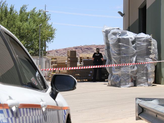 Northern Territory police at the Harvey Norman warehouse on Smith St, Alice Springs, on Tuesday February 4. Picture: Gera Kazakov