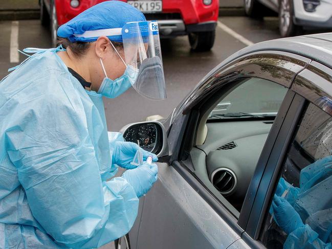 A health worker conducts a test at a COVID-19 coronavirus testing centre in the suburb of Northcote in Auckland. Picture: AFP.