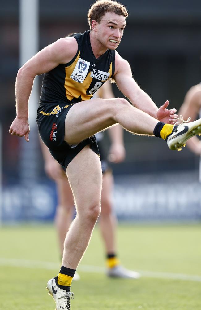 Norm Goss Medal winner Jack Henderson takes a kick for Werribee in the grand final. Photo: Michael Willson/AFL Photos via Getty Images