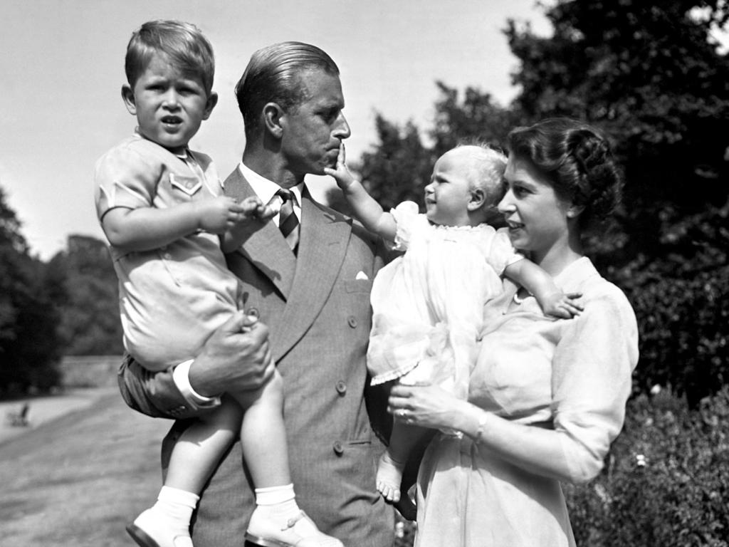 Prince Philip and the Queen in 1951 with their children Prince Charles and Princess Anne. Picture: PA/PA Wire