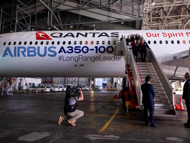 An Airbus A350-1000 aircraft is seen inside a hangar at Sydney international airport on May 2, 2022, to mark a major fleet announcement by Australian airline Qantas. - Qantas announced on May 2 it will launch the world's first non-stop commercial flights from Sydney to London and New York by the end of 2025, finally conquering the "tyranny of distance". (Photo by Wendell TEODORO / AFP)