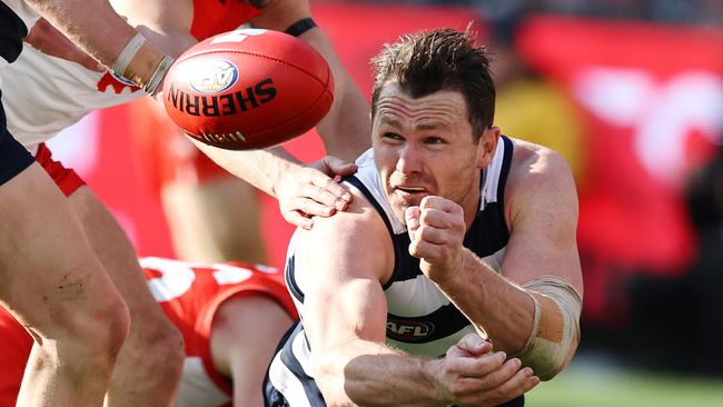 Patrick Dangerfield gets away a handball as the Cats even had the measure of the Swans at ground level. Picture: Michael Klein