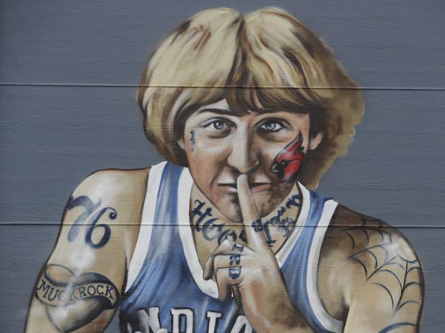 A mural of former NBA star Larry Bird is seen on the side of a multi-family residence in Fountain Square, Wednesday, Aug. 21, 2019, in Indianapolis. Larry Bird likes the mural but not the tatts. Bird's attorney, Gary Sallee, says the former Indiana Pacers executive "needs to protect" his brand and "doesn't want to be seen as a tattooed guy." Artist Jules Muck says she was just trying to be funny. The mural is a replica of Bird's appearance on a 1977 Sports Illustrated cover when he played college ball for Indiana State. (AP Photo/Darron Cummings)