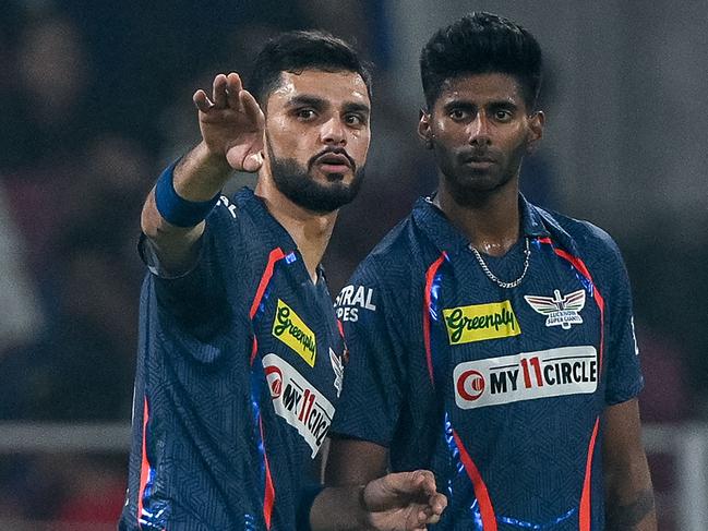 Lucknow Super Giants' Naveen-ul-Haq and teammate Mayank Yadav talk during the IPL clash with Punjab Kings. PIcture: AFP