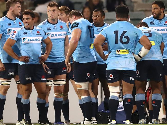 Waratahs players look dejected after conceding a try during against the Brumbies.