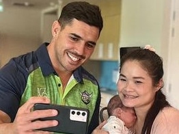 Raiders halfback Jamal Fogarty does a selfie with local mum Mu Dah and her baby at Ronald McDonald House in Canberra. Picture: Supplied