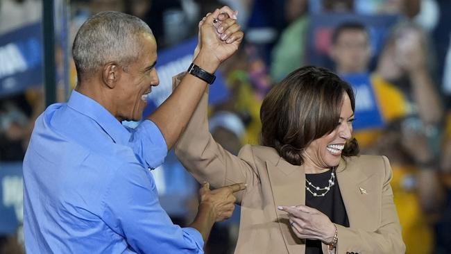 Former President Barack Obama gestures to Democratic presidential nominee Vice President Kamala Harris after introducing her to speak during a campaign rally for Harris on Thursday, Oct. 24, 2024, in Clarkston, Ga. (AP Photo/Mike Stewart)