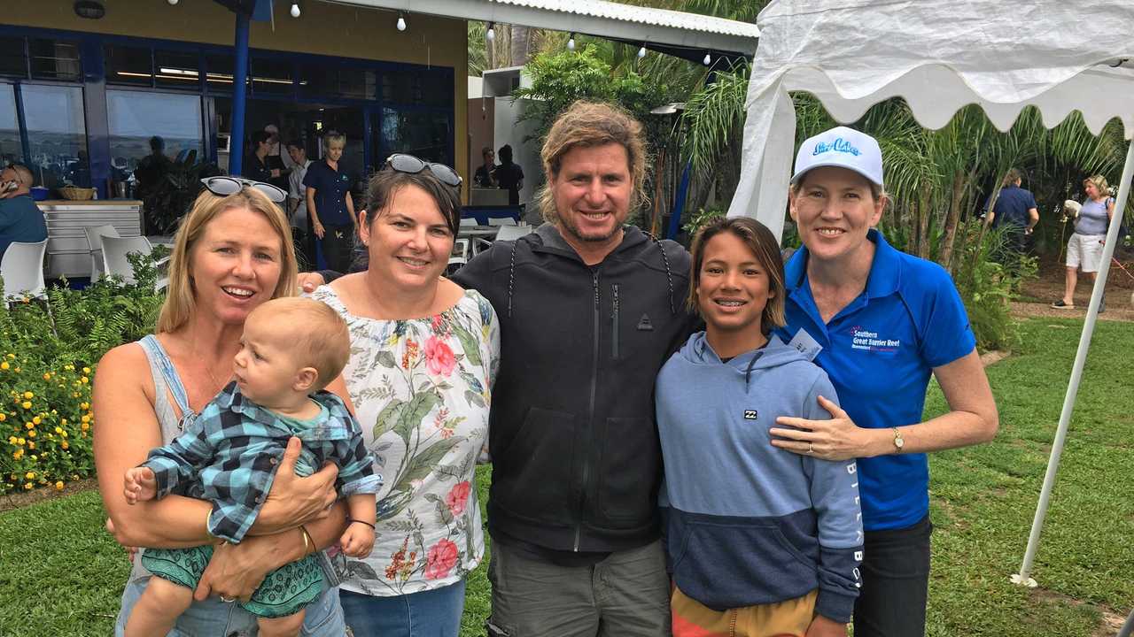 Mark Occhilupo and his wife and kids with Keppel Bay Marina General Manager Kylie Smith and Capricorn Enterprise CEO Mary Carroll.