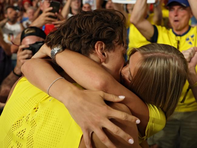 Gold medallist Armand Duplantis of Sweden celebrates by kissing his girlfriend Desire’ Inglander after setting a new world record and winning the gold medal in the Men's Pole Vault Final Picture: Patrick Smith/Getty Images