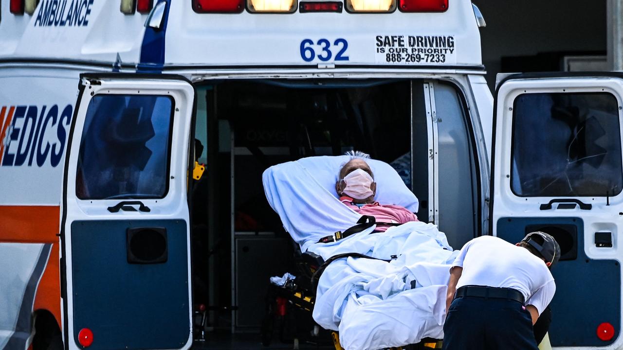 Medics transfer a patient from an ambulance outside Coral Gables Hospital near Miami, Florida this month. Picture: Chandan Khanna/AFP