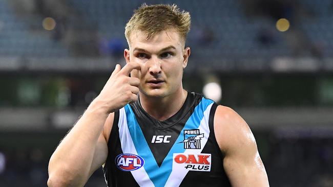 MELBOURNE, AUSTRALIA - AUGUST 17: Ollie Wines and his Power team mates look dejected after losing the round 22 AFL match between the North Melbourne Kangaroos and the Port Adelaide Power at Marvel Stadium on August 17, 2019 in Melbourne, Australia. (Photo by Quinn Rooney/Getty Images)