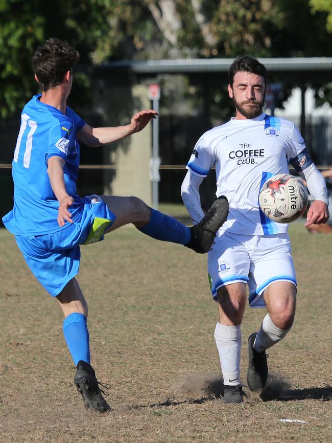 Palm Beach's Jake Martin (left) and Surfers Paradise’s Bruno Rodriguez do battle at Lex Bell Oval on Saturday. Picture: Glenn Hampson