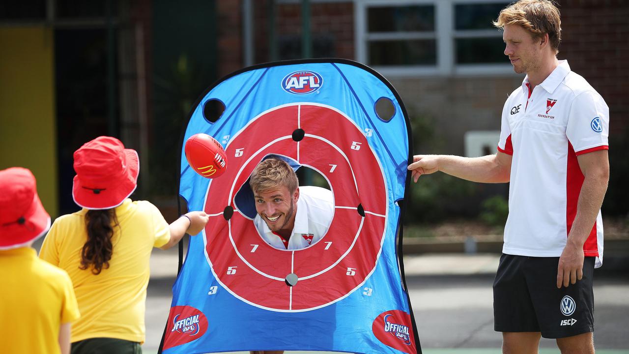 Sydney Swans players Kieren Jack and Callum Mills at a Swansfit coaching clinic at Chifley Public School in Malabar. Picture: Phil Hillyard