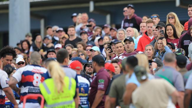 Spectators watch the scene unfold. Photo: Scott Powick