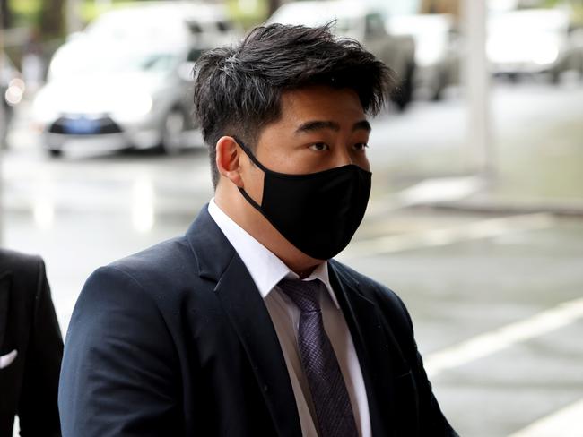 SYDNEY, AUSTRALIA - NewsWire Photos NOVEMBER 4, 2021: Junchi Ma pictured as he arrives at Downing Centre Courts, Sydney CBD. Trial begins of Junchi Ma, a Sydney man who's alleged to have stolen millions from Commonwealth Bank customers with the help of his girlfriend. Picture: NCA NewsWire / Damian Shaw