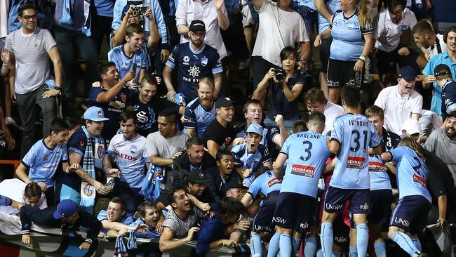 The fence at Leicchardt Oval collapses under the weight of Sydney FC fans celebrating Cameron Devlin’s goal. Fortunately no one was seriously hurt. Picture: Getty Images 