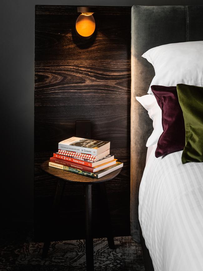 Stillwater Seven's cloud-like beds with bedside table thoughtfully stacked with some great reads by well-known Tasmanian authors. Picture: Anjie Blair