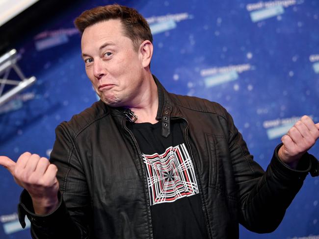 SpaceX owner and Tesla CEO Elon Musk poses as he arrives on the red carpet for the Axel Springer Awards ceremony, in Berlin, on December 1, 2020. (Photo by Britta Pedersen / POOL / AFP)