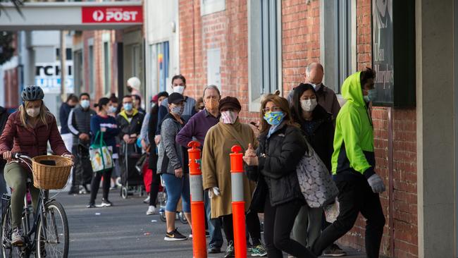 Lines of shoppers seen at Aldi South Melbourne. Photo: Paul Jeffers/The Australian